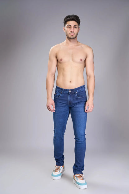 Full body front view of men’s classic regular fit jeans in blue denim

