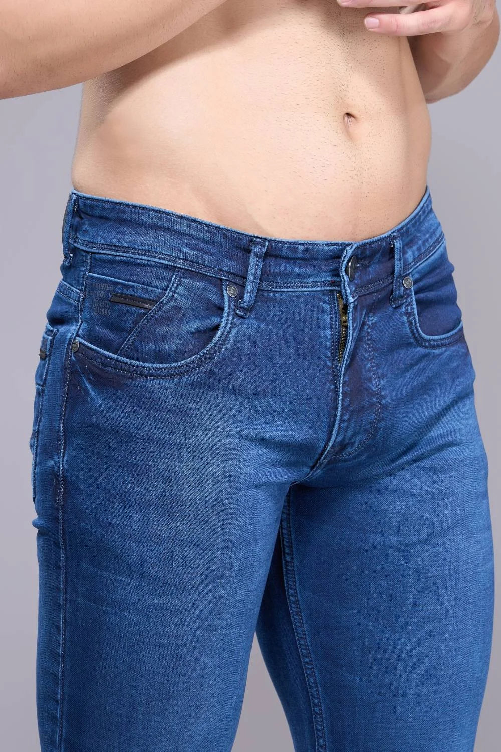 Close-up view of soft stretch regular fit denim jeans for men

