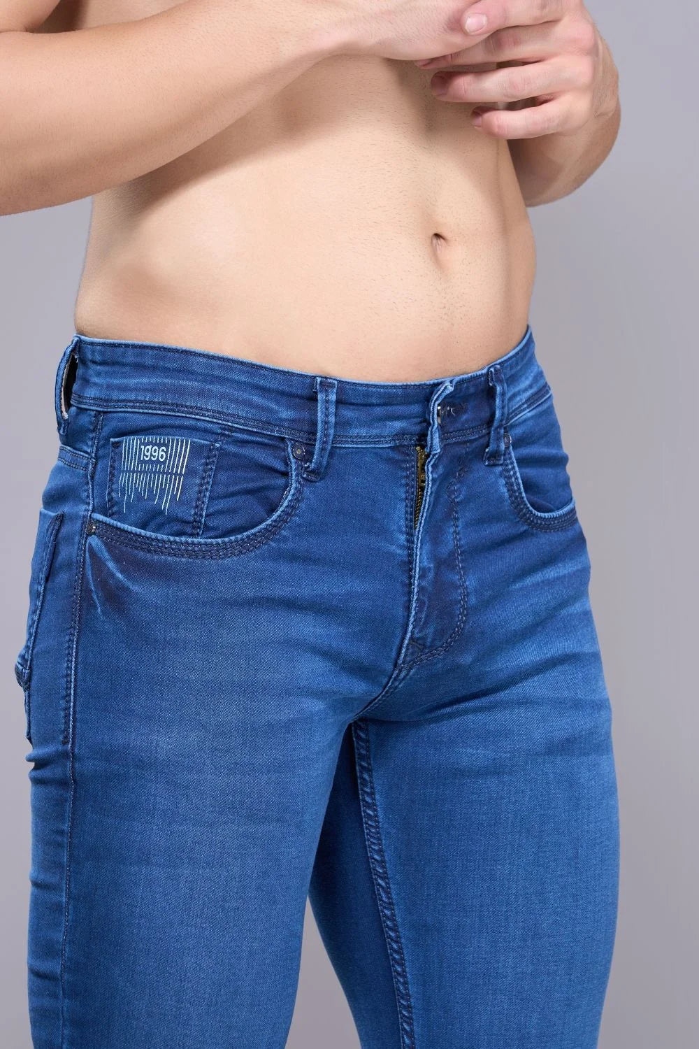 Close-up of flexible stretchable denim fabric in men’s regular fit jeans
