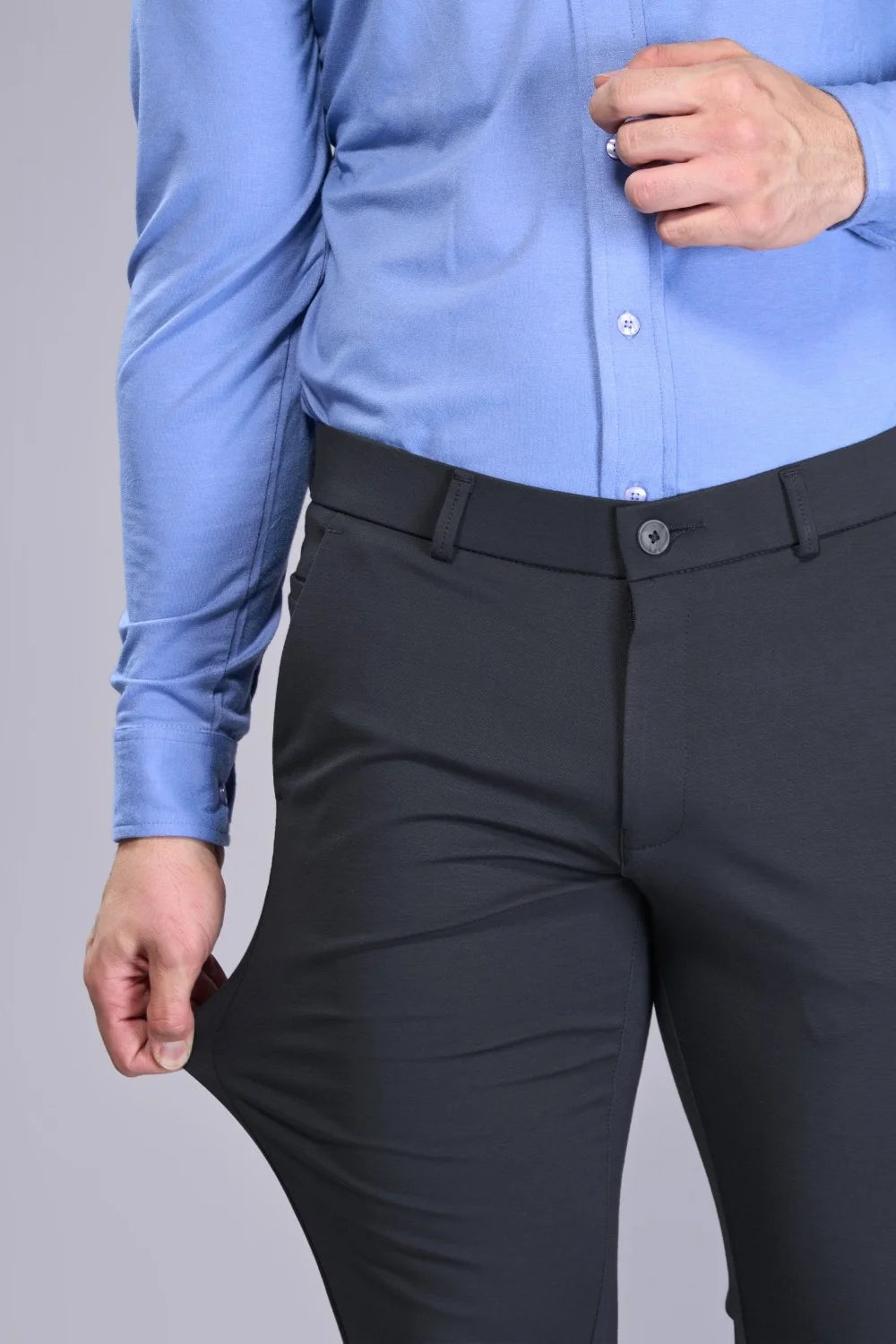 Modern tapered-fit trousers in black with clean minimal styling
