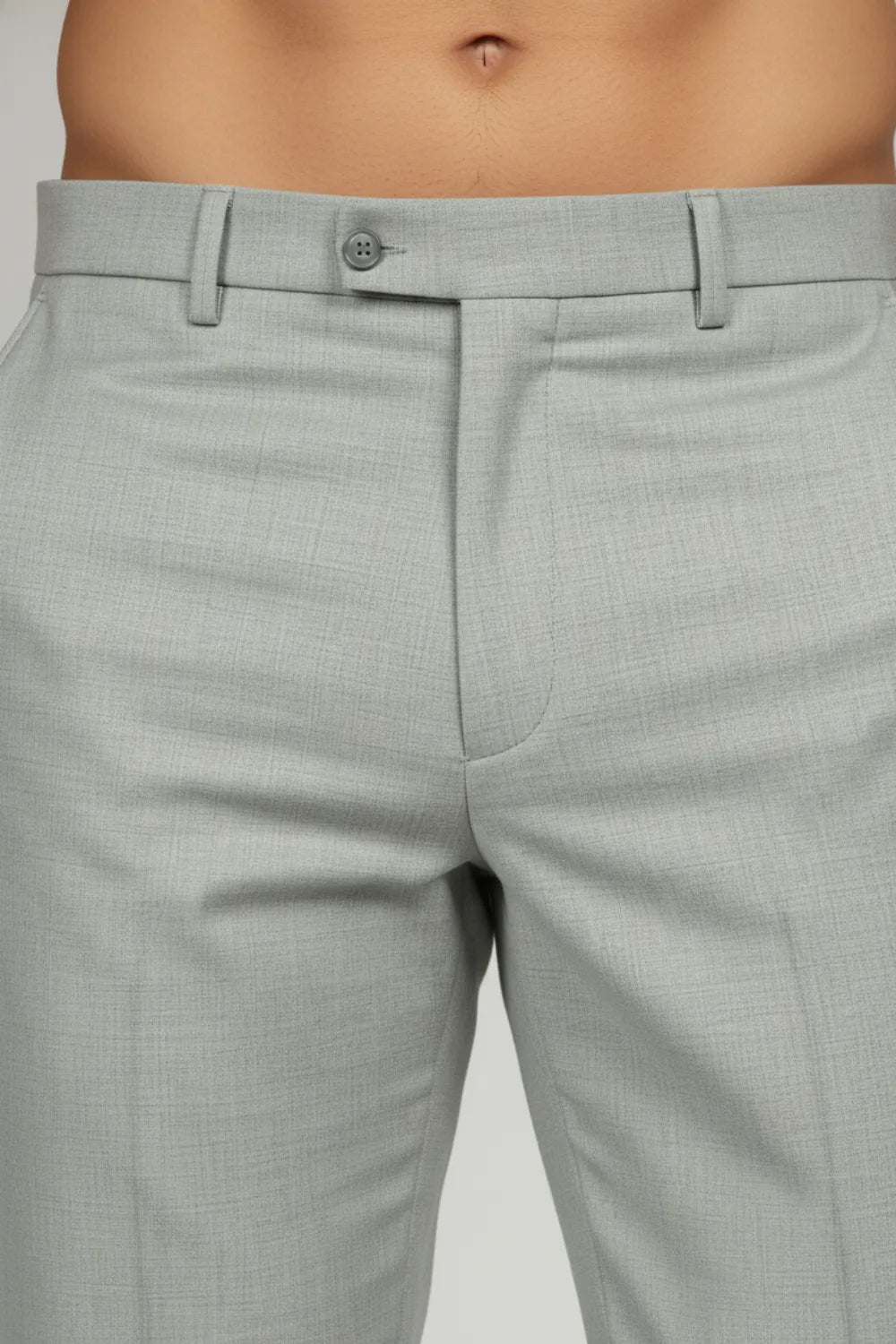 Close-up showing the intricate grey texture on white formal pants.