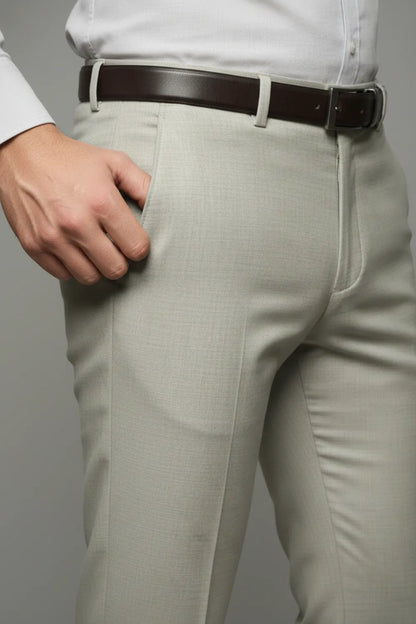 Light White pants with a brown belt on a plain background